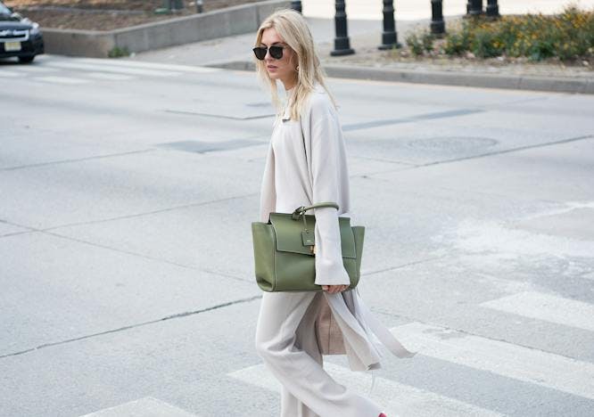 car road sunglasses accessories clothing tarmac sleeve person handbag bag