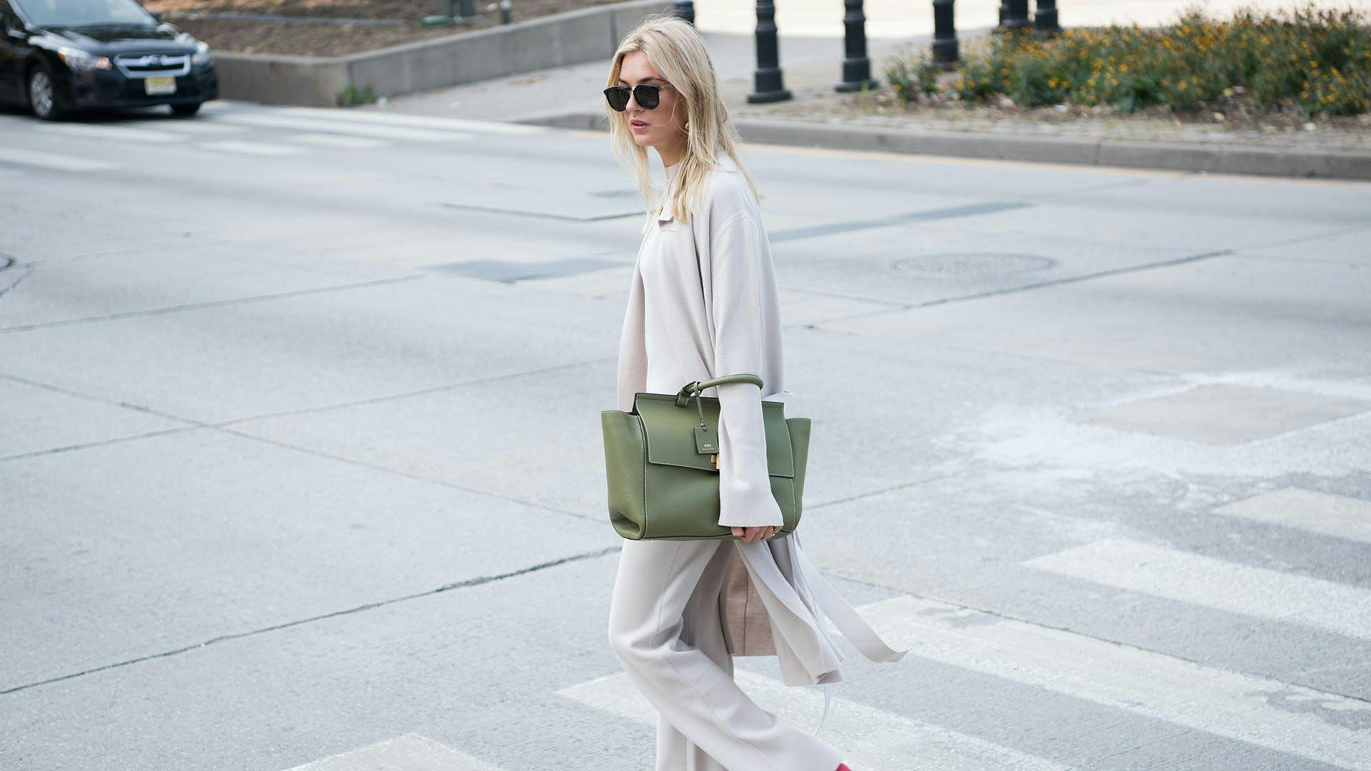 car road sunglasses accessories clothing tarmac sleeve person handbag bag