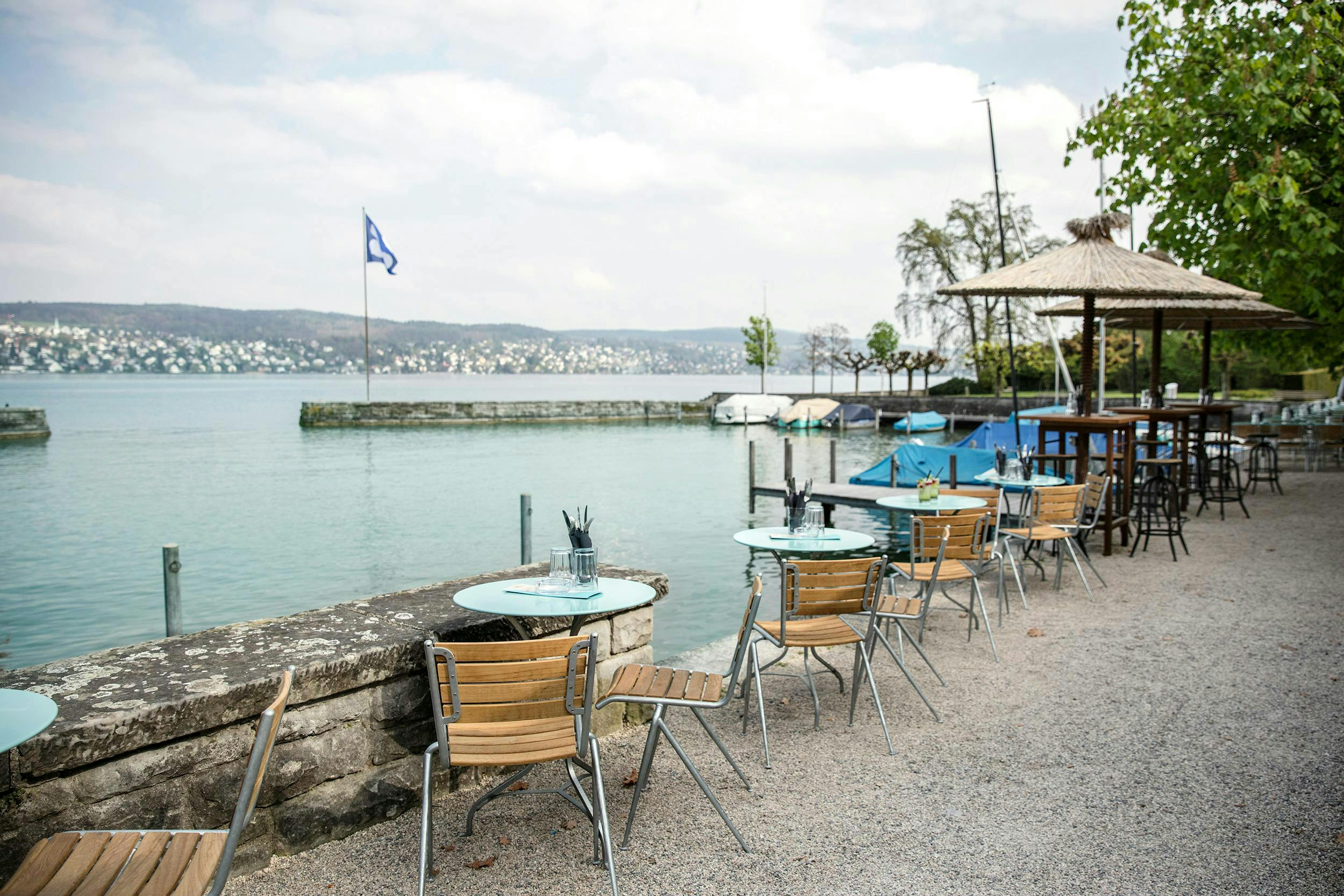kilchberg peclard restaurant mönchhof thalwil chair furniture water wood waterfront