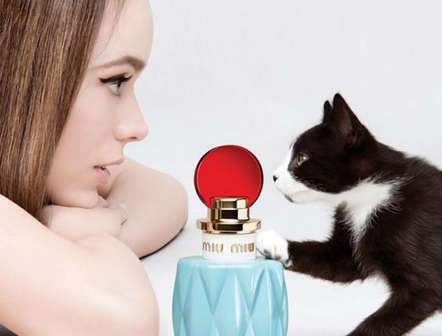 perfume bottle cosmetics person human cat animal mammal pet