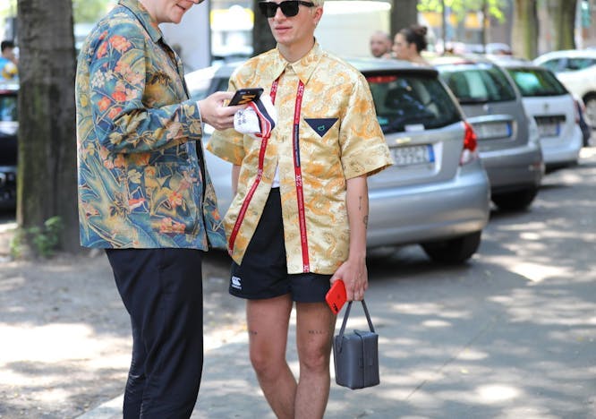 person clothing sunglasses accessories shorts car transportation sleeve wheel machine