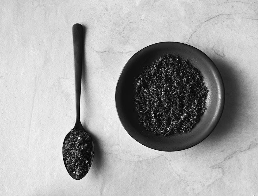 artisanal background black black and white bowl ceramic charcoal coarse copy space crystal flat lay flavour food gourmet handcrafted handmade monochrome overhead salt saucer sea salt seasoning small spice spoon cutlery