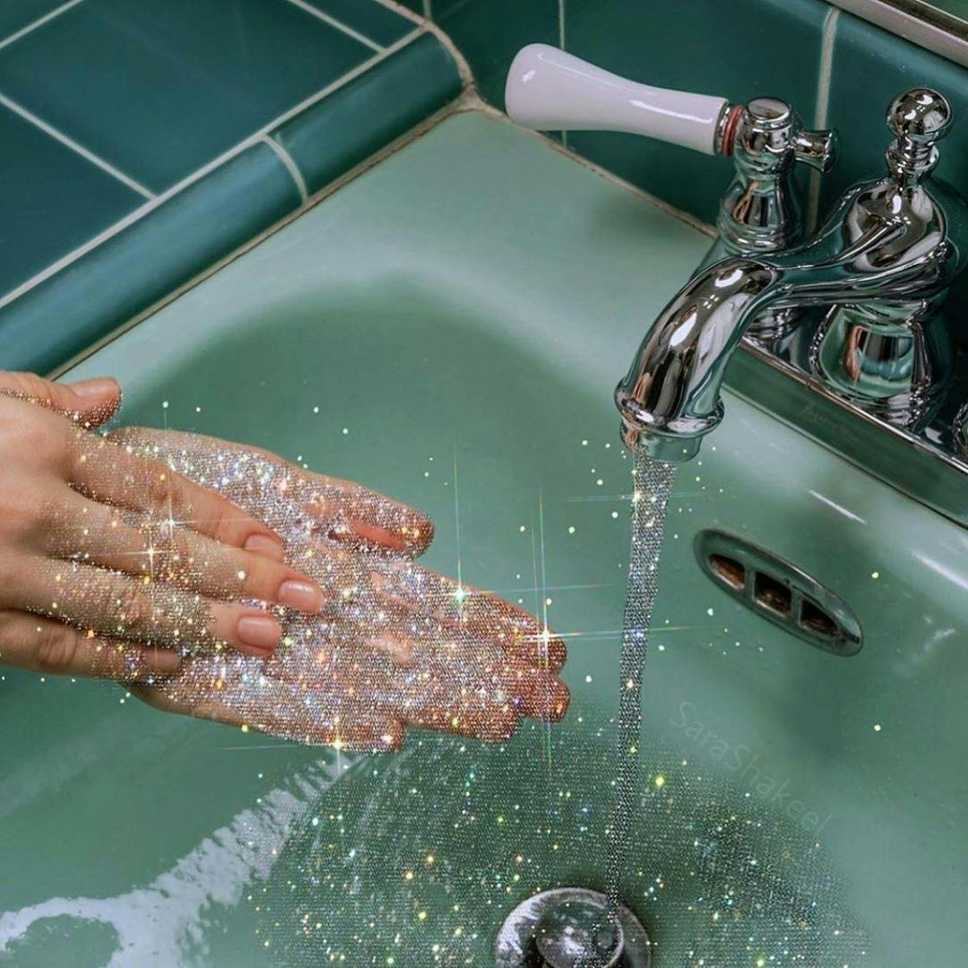 person human washing sink faucet